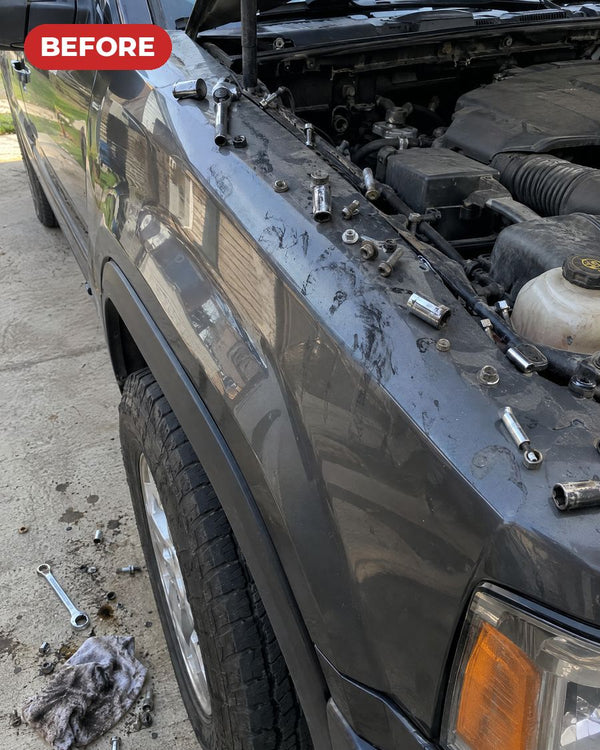 Before: bolts and sockets scattered on the fender and the ground
