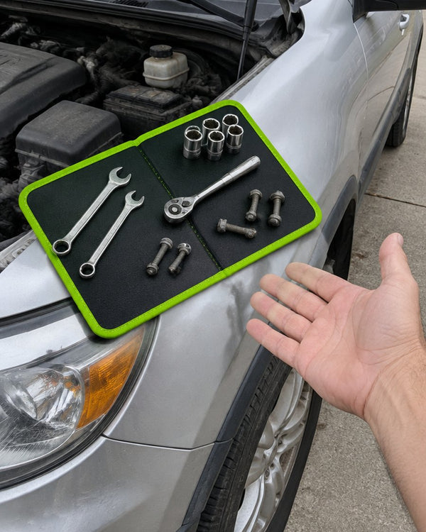 Tools organized on the magnetic mat on the fender