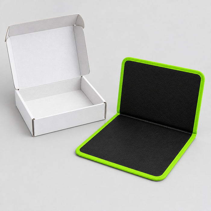 Folding magnetic mat next to its plain white box